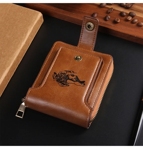 Detail of vintage brown leather wallet with cowboy pattern, zipper and snap closure