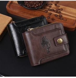 Close-up of vintage leather wallets with cowboy embossing and star metal snap buttons