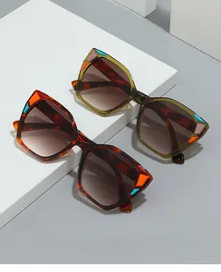Detail view of cat eye glasses frames in dark tortoiseshell and olive green color