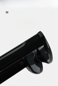 Detail view of glossy black sunglasses showing the durable hinge and wide temple design