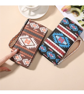 Bohemian style long zipper wallet with ethnic geometric prints and wrist strap detail