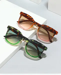 Close-up of retro tortoiseshell frames and gradient lenses with metal nose pads