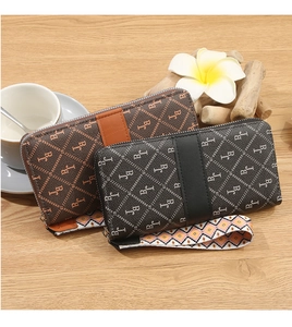 Brown and black PU leather long wallets with BJ print and bohemian wristlet on wood