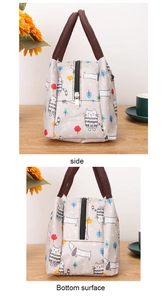 Detail view of the side and bottom surface of a grey cartoon cat thermal lunch bag