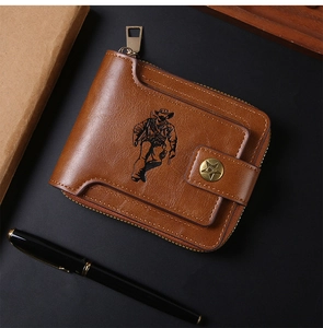 Brown leather wallet detail featuring western cowboy print and snap closure design