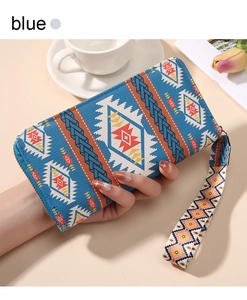Close-up of a long bohemian geometric printed wallet with a detachable wrist strap