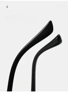 Detail view of glossy black curved temples on oval sunglasses for comfort wear