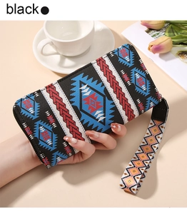 Bohemian style black clutch wallet with geometric patterns and a detachable wristlet