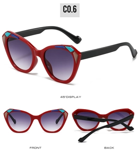 Red cat eye sunglasses featuring purple gradient lenses and geometric colorful corner accents