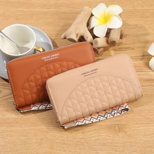 Women's long zippered wallets in brown and pink PU leather with geometric wrist straps