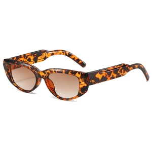 Retro tortoise shell cat-eye sunglasses with brown gradient lenses on white background