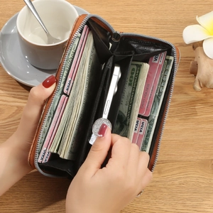 Brown long zip wallet with checked pattern showing large capacity and card slots