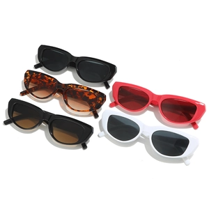 Five pairs of trendy retro cat-eye sunglasses in black, white, red, and tortoiseshell