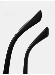 Macro detail of ergonomic curved temples on black sunglasses for comfortable wearing