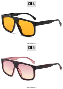 Detailed 45-degree view of futuristic oversized sunglasses with orange and pink gradient lenses