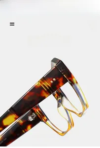 Close-up of tortoise shell glasses frames featuring high-quality metal hinges and specs