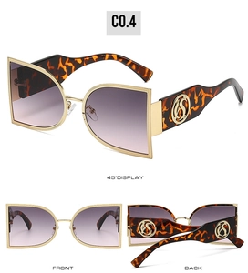 Detail of semi-round metal sunglasses with gradient purple lenses and tortoiseshell temples