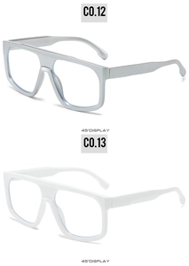Detailed 45-degree side view of oversized square sunglasses frames in silver and white