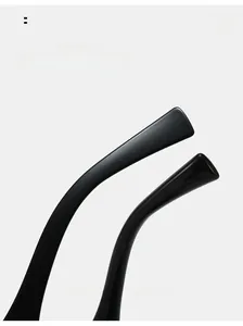 Macro detail of ergonomic curved black temple tips on stylish semi-round sunglasses