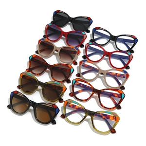 Flat lay of cat-eye sunglasses and optical frames in multiple geometric colors