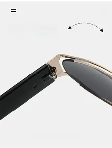 Detail of durable gold metal hinges on futuristic oval sunglasses with a black frame