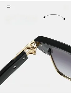 Detailed macro view of durable gold metal hinges on square black frame sunglasses