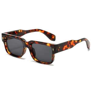 Retro square tortoiseshell sunglasses with dark lenses and gold diamond rivets on white background