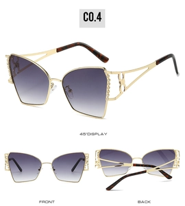 Lunettes soleil œil-de-chat dorées avec verres violets et strass sous trois angles