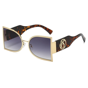 Modern semi-round oversized metal sunglasses with gold frames and gradient lenses