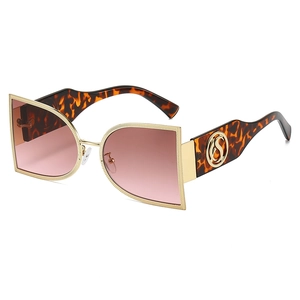 Fashionable oversized semi-round tortoise sunglasses with gold metal trim and gradient lenses