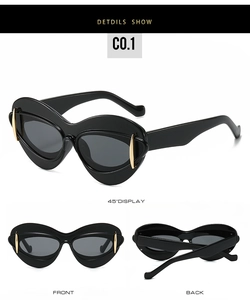 Vues détaillées des lunettes de soleil œil de chat noires avec accents dorés sur le cadre