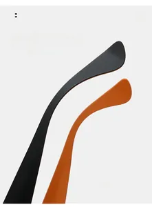 Detail of ergonomic curved temple arms in black and orange for oval sunglasses