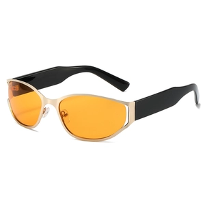 Futuristic oval sunglasses with gold frames, orange lenses and black temples for Y2K style