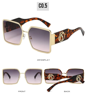 Detail view of large square metal sunglasses with leopard temples and gradient lenses