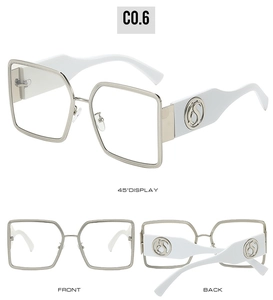 Detail of silver metal frame with woven texture and white temples on square sunglasses
