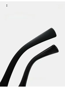 Detailed close-up of curved glossy black temple tips on stylish metal sunglasses