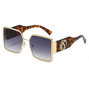Fashionable oversized square sunglasses with gold metal frame and purple gradient lenses