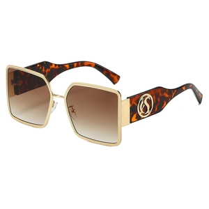 Fashionable oversized square sunglasses with gold metal frame and gradient brown lenses