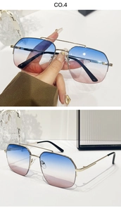 Detail of pilot sunglasses with gradient blue-pink lenses and gold metal double bridge frame