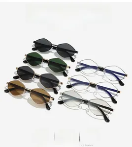 Flat lay of seven hexagonal metal sunglasses in various colors including black and green