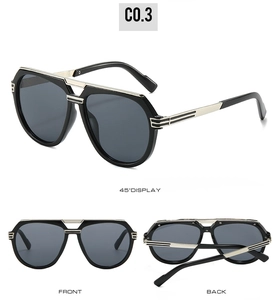 Detail view of vintage pilot sunglasses with bold black frames and silver double bridges
