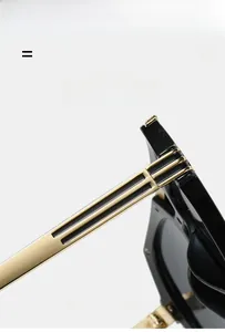 Detail of lightweight elastic gold metal temples on vintage black sunglasses