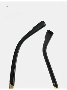 Detail of ergonomic curved mirror legs in black and gold for vintage sunglasses