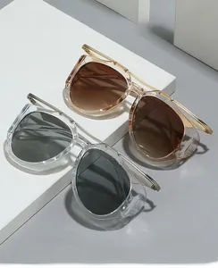 Detail of oval sunglasses featuring metal temples and side shields in two color options