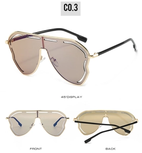 Lunettes de soleil métalliques irrégulières avec rayures évidées et verres bruns