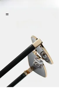 Detail of metal hinge and adjustable silicone nose pads on irregular polarized sunglasses