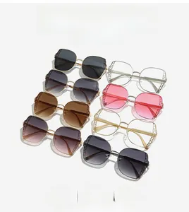 Detailed close-up of fashion sunglasses featuring mesh frames and elegant V-shaped accents
