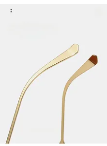 Detail of slim curved golden metal temples for sunglasses with lightweight comfort fit