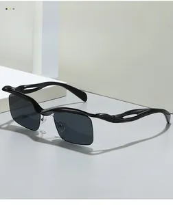 Close-up of black sunglasses featuring a unique 3D wave texture on the temples and semi-rimless lens