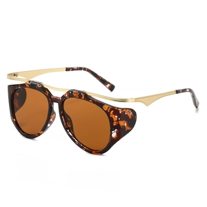 Retro oval sunglasses with tortoise shell frame and gold metal temples from 45-degree angle